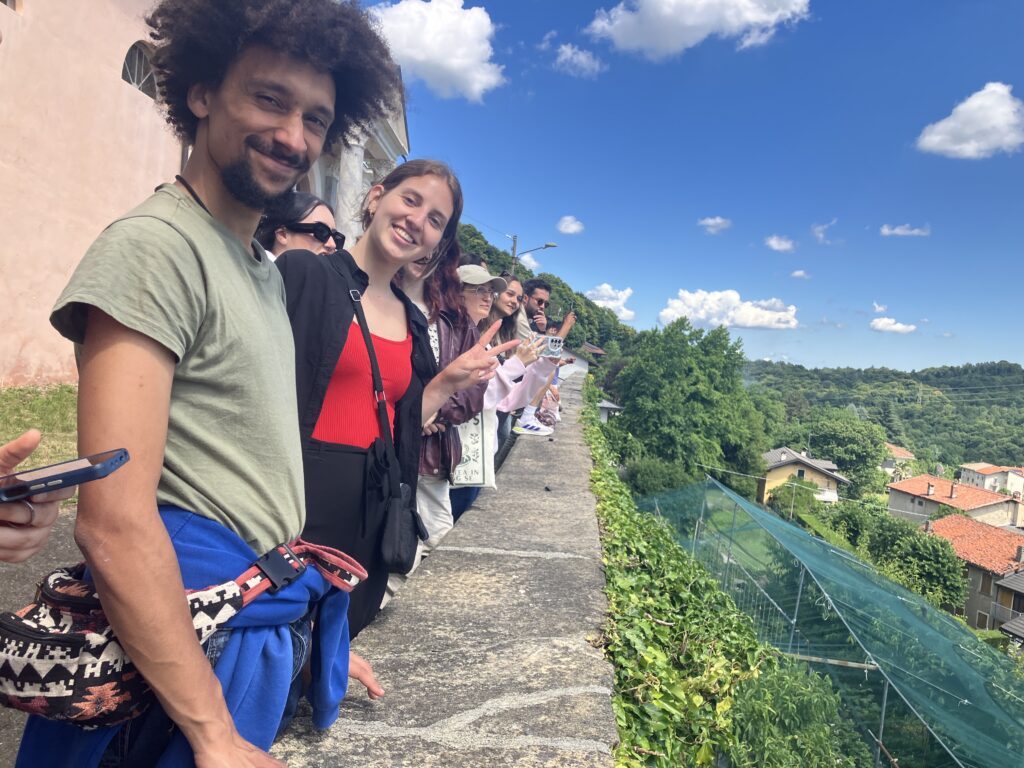 Young participants of the Documentary Circles Rural Youth Exchange pose together while exploring a village in Valchiusella, Italy.
